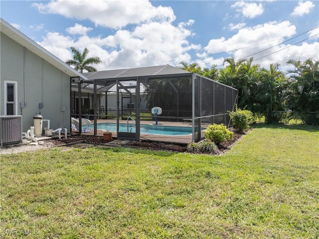 pool with a lanai and a yard