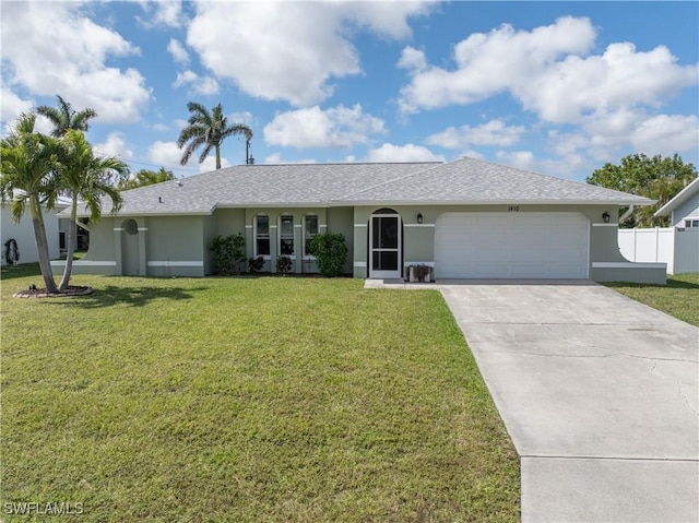 single story home with a garage, driveway, a front yard, and stucco siding