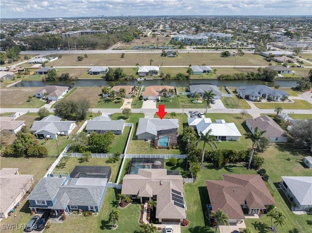 bird's eye view with a water view and a residential view