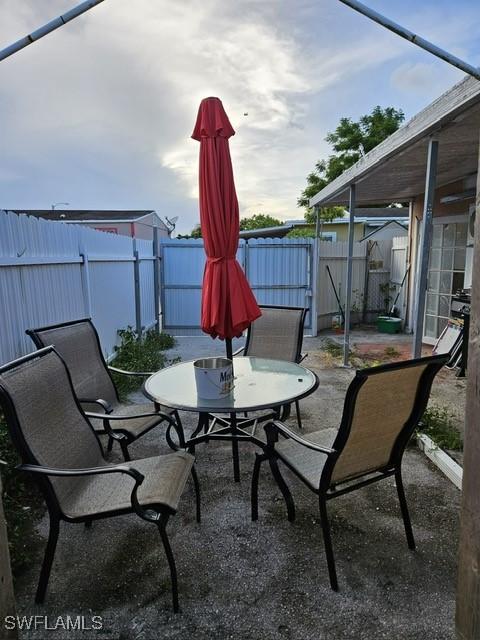 view of patio featuring outdoor dining area and a fenced backyard