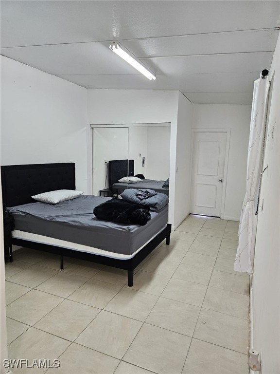 bedroom featuring light tile patterned floors