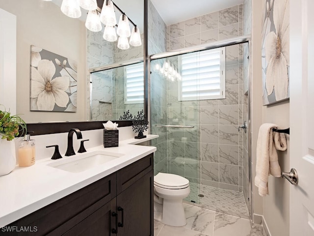 full bath featuring marble finish floor, a shower stall, toilet, and vanity