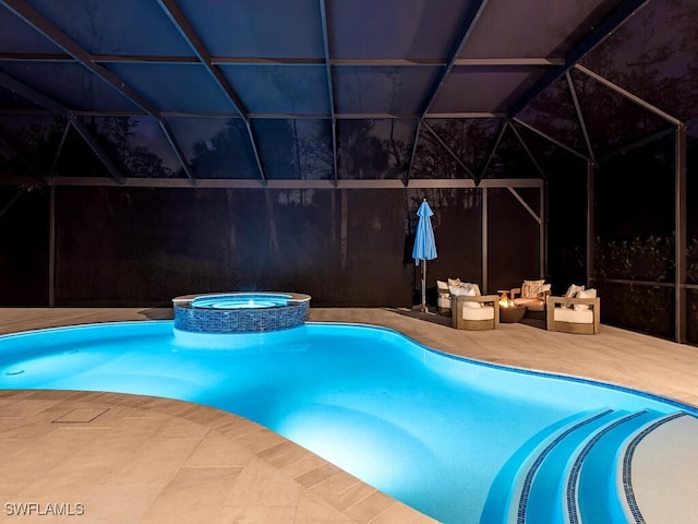 view of swimming pool with a pool with connected hot tub, a patio area, and a lanai