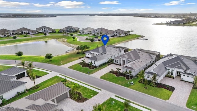 bird's eye view featuring a residential view and a water view