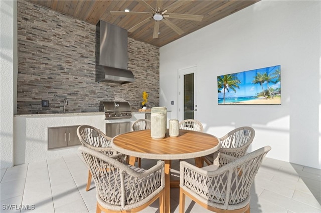 tiled dining area with wood ceiling, ceiling fan, and a sink