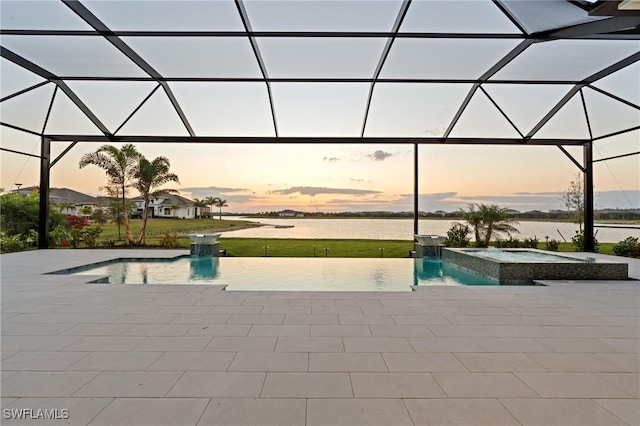 view of pool featuring a water view, a lanai, and a patio area