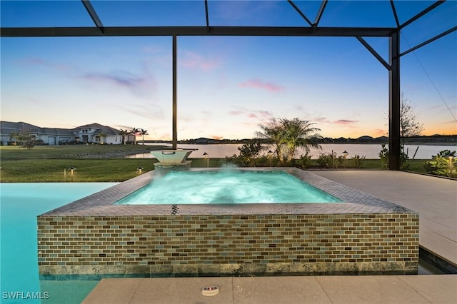 view of pool featuring glass enclosure, an in ground hot tub, and a patio