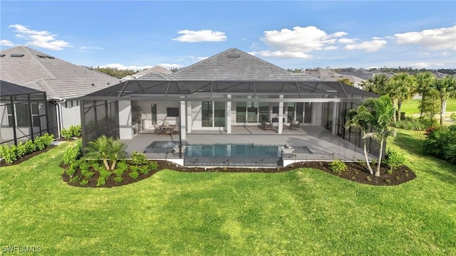 rear view of house with a lanai, a lawn, and a patio