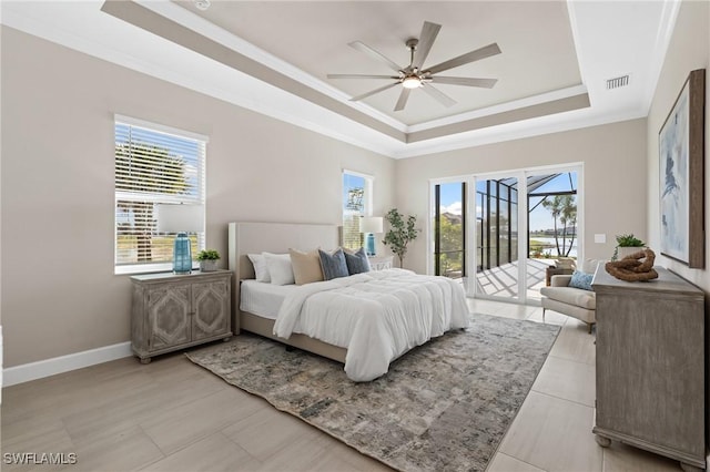 bedroom with visible vents, ornamental molding, baseboards, a raised ceiling, and access to exterior