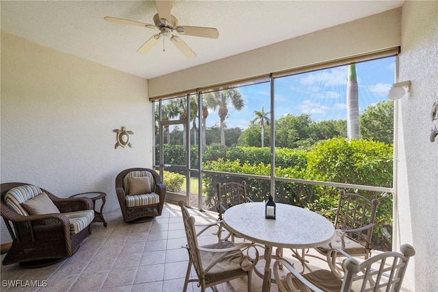 sunroom featuring ceiling fan