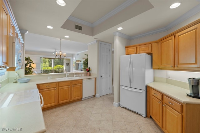 kitchen with white appliances, a raised ceiling, a sink, and light countertops