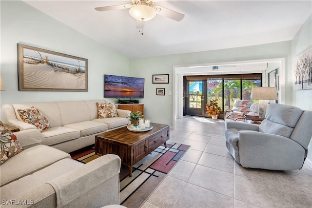 tiled living area with a ceiling fan