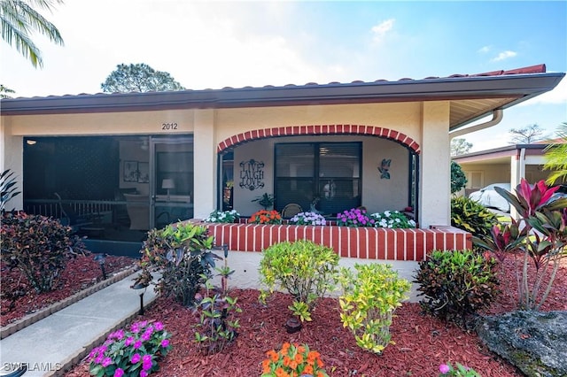 view of front of property with covered porch and stucco siding