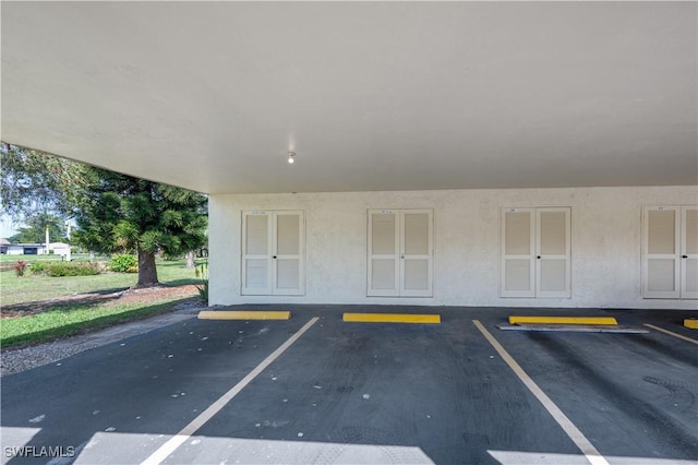 garage featuring covered parking and french doors