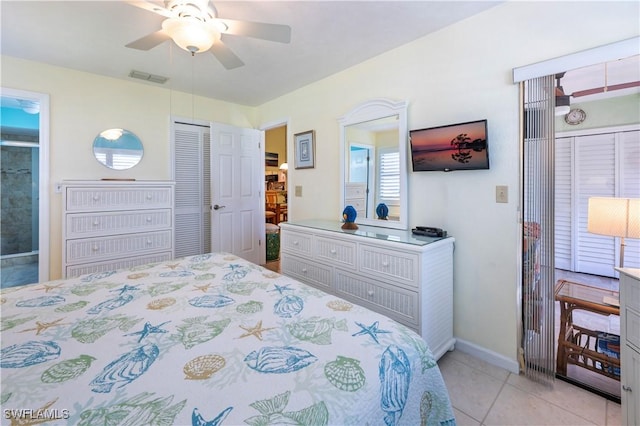 bedroom featuring visible vents, baseboards, ceiling fan, light tile patterned floors, and a closet