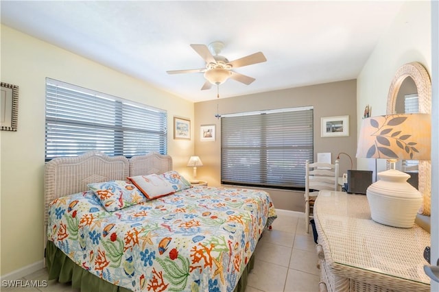 bedroom with baseboards, ceiling fan, and tile patterned flooring