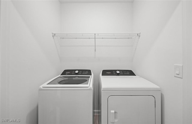 laundry area featuring laundry area and independent washer and dryer