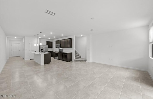 living room featuring light tile patterned floors, recessed lighting, visible vents, stairway, and baseboards