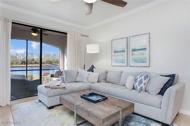 living room featuring ornamental molding, ceiling fan, and light tile patterned floors