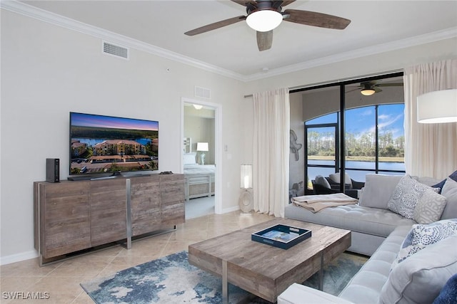 tiled living room with visible vents and crown molding