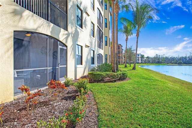 exterior space with a water view