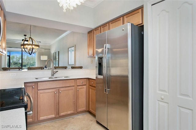 kitchen featuring electric range, a sink, ornamental molding, stainless steel fridge, and an inviting chandelier