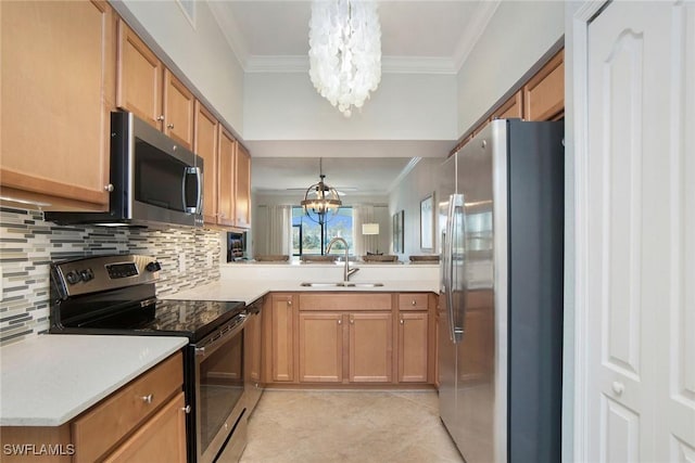 kitchen featuring appliances with stainless steel finishes, crown molding, a sink, and an inviting chandelier