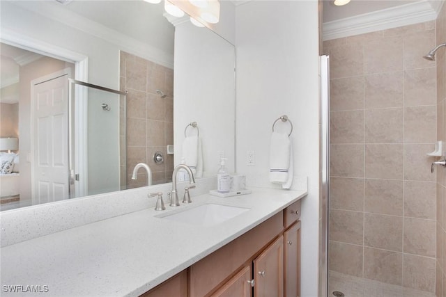 bathroom featuring a shower stall, crown molding, and vanity