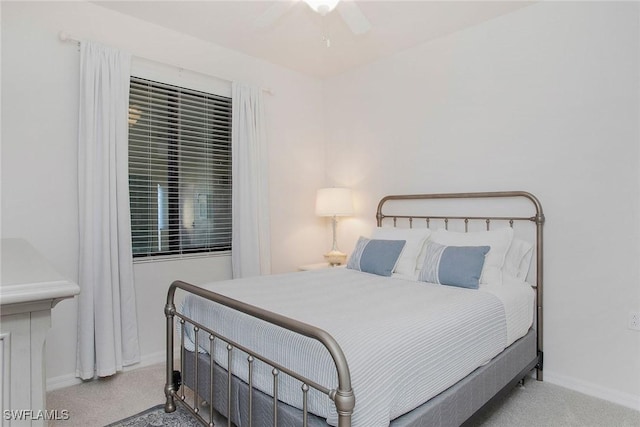 bedroom featuring carpet floors, a ceiling fan, and baseboards