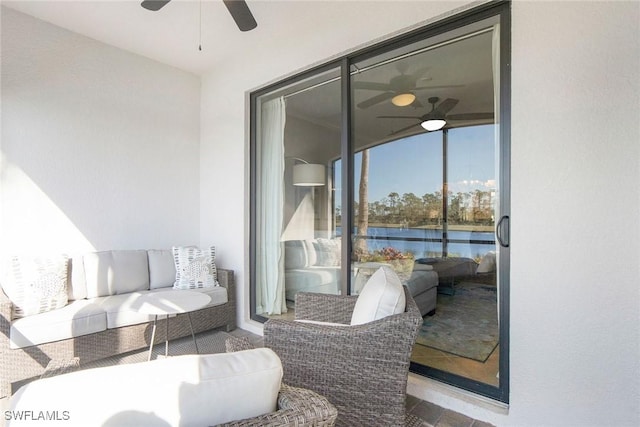 view of patio / terrace featuring ceiling fan and an outdoor living space