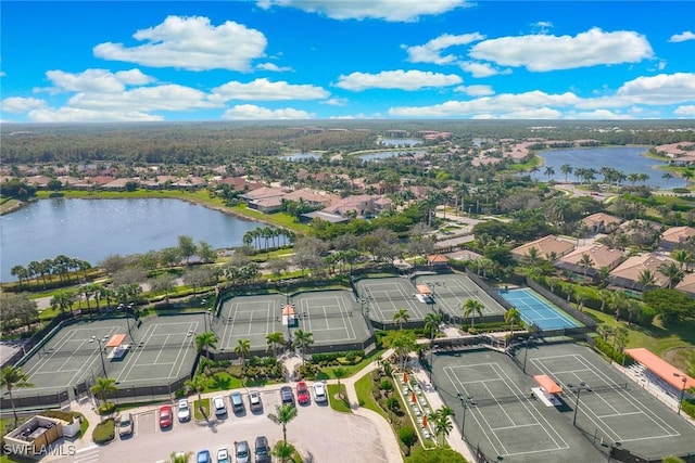 bird's eye view featuring a water view and a residential view