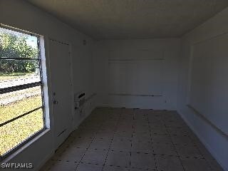 empty room with tile patterned floors