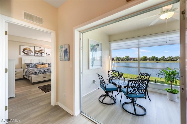 interior space featuring visible vents and a water view