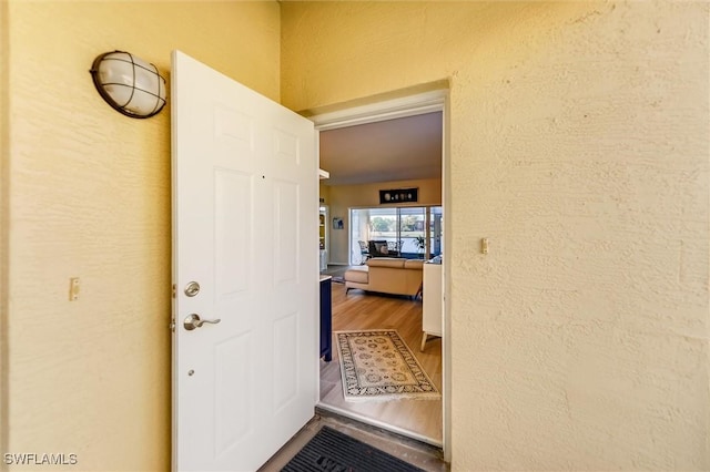 entrance to property with stucco siding