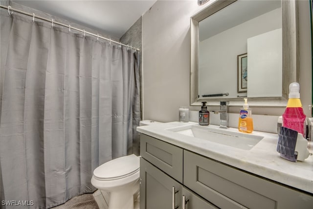 full bath with vanity and toilet