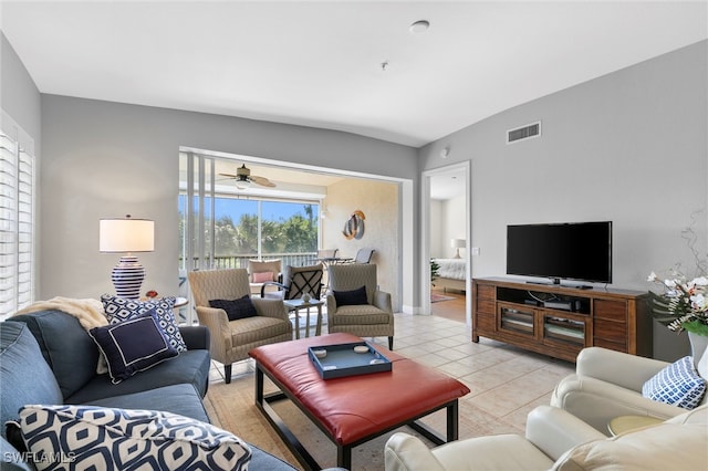 living room with light tile patterned floors and visible vents