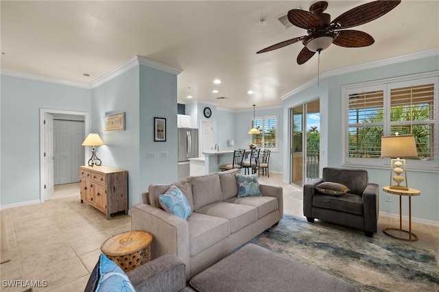 living area featuring light tile patterned floors, ceiling fan, recessed lighting, baseboards, and ornamental molding