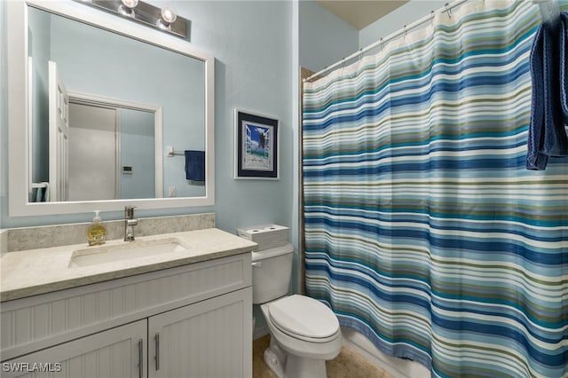 bathroom with toilet, curtained shower, and vanity