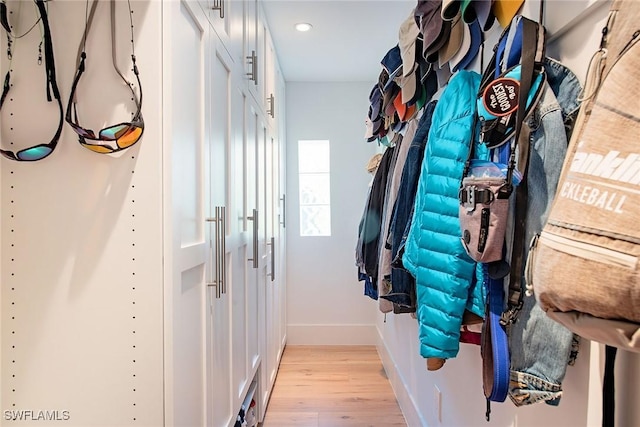 interior space featuring baseboards, recessed lighting, and light wood-style floors