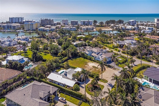 drone / aerial view featuring a water view and a city view