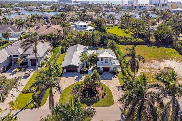 bird's eye view featuring a water view and a residential view