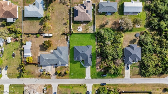 birds eye view of property with a residential view