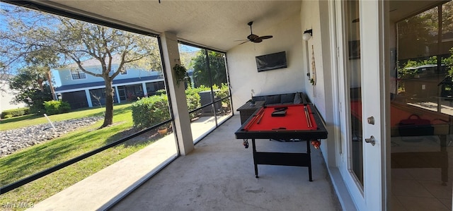 sunroom with billiards and ceiling fan