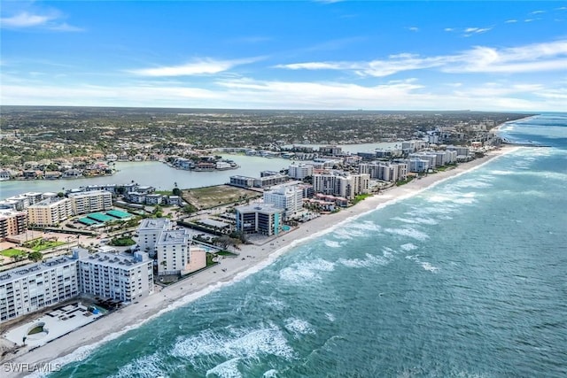 aerial view with a water view, a beach view, and a city view