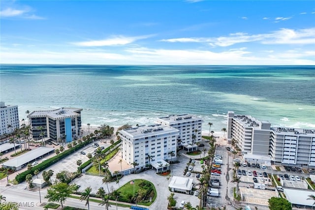 drone / aerial view featuring a view of city and a water view