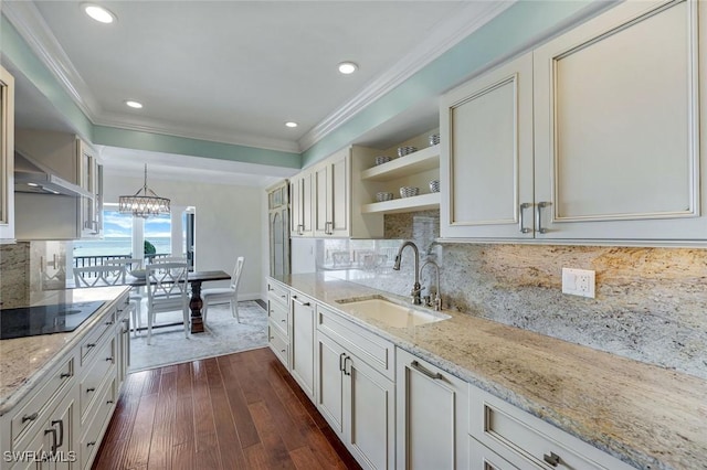 kitchen with open shelves, black electric stovetop, a sink, and crown molding