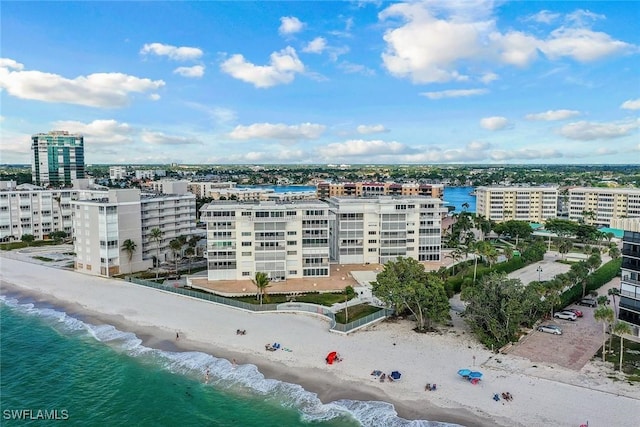 bird's eye view with a view of city, a water view, and a beach view