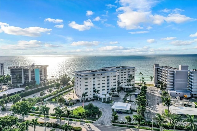 drone / aerial view featuring a water view and a city view