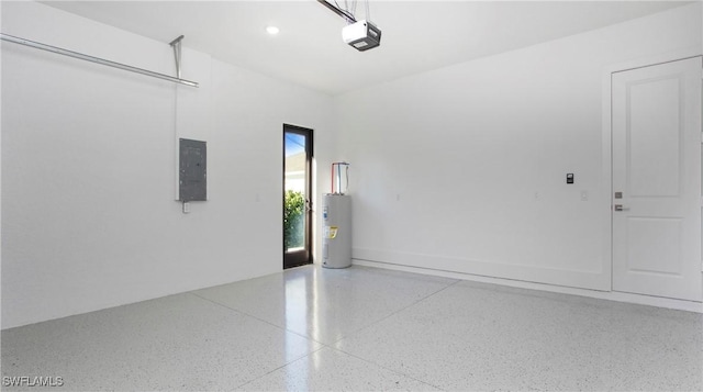 garage with water heater, recessed lighting, a garage door opener, and electric panel