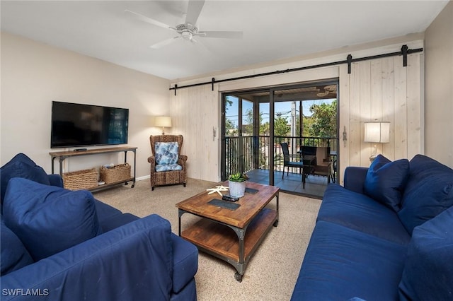 845 E Gulf Dr Unit 232, Sanibel, FL 33957 - carpeted living area featuring a barn door and ceiling fan